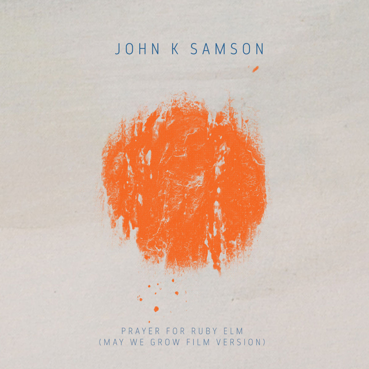 copertina del singolo "Prayer for Ruby Eml" di John K. Samson: un semplice quadrato di carta con una macchia di colore arancione al centro